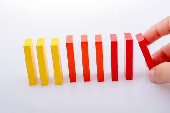 Hand holding color dominoes