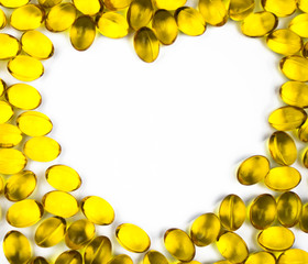 Heart shaped of cod liver oil isolated on white background with copy space. Source of Omega-3 (DHA+EPA) and vitamin A & D helps growth development and absorption of calcium and phosphorous in the body