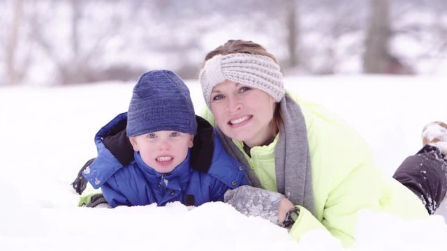 Potrait of mother and son in the snow