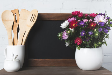 blank board and kitchen utensils