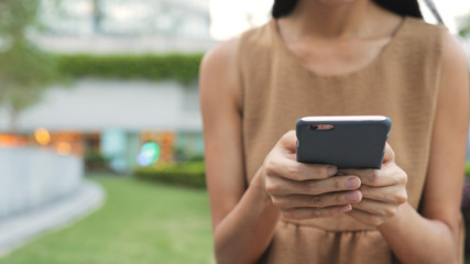 Woman using cellphone in the city