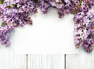 Lilac flowers with empty card
