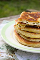 Traditional homemade Romanian and Moldovan pies - Placinta. Rustic style, selective focus.