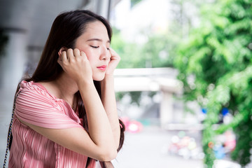Young asian lady working outdoors