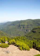 Obraz premium Picturesque aerial panorama of mountains and rainforest hills on Madeira island, Portugal.
