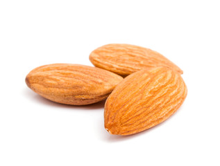 Group of almonds isolated on white background