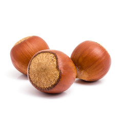 Fresh three hazelnuts isolated on white background. 