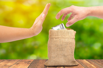 A theft money concept, A hand theft money from sack bag with dollar sign, Protect your business