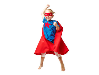 Very excited little girl dressed like superhero jumping isolated on white background.