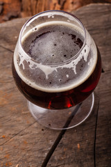 Dark beer on stump