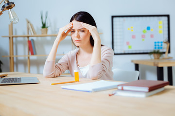 Attentive office worker having some thoughts