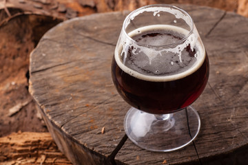 Dark beer on stump