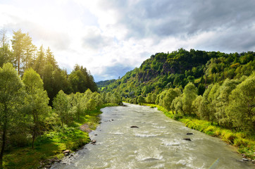 Fototapeta na wymiar Mountain river Avisio near the town of Cavalese in valley Val di Fassa.South Tyrol,Italy.