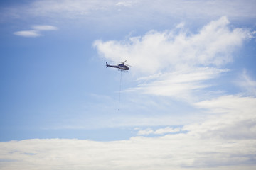 helicopter carry cargo in the sky
