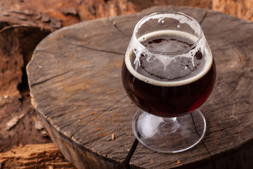 Dark beer on stump