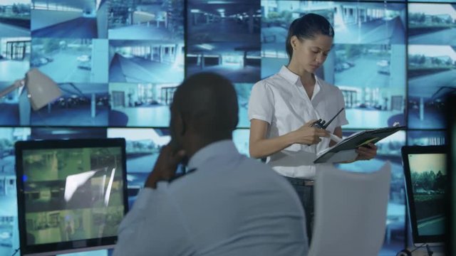  Time lapse busy security staff watching the screens in observation control ro