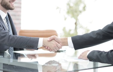 handshake of business partners on business negotiations