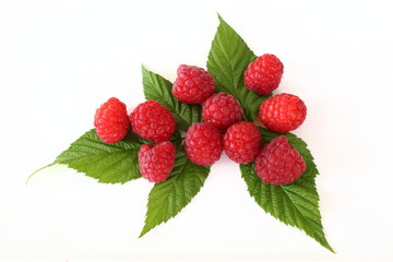 fresh red raspberry fruits isolated on a white background