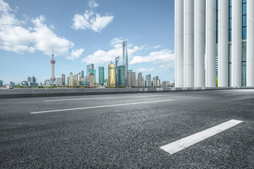 empty asphalt road with city skyline background,shanghai,china.