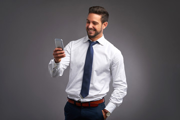 Happy young man with a smartphone