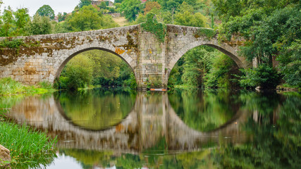 Fototapeta premium River and medieval bridge in Allariz, Orense, Spain