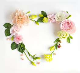 Flowers composition with place for text. Frame made of fresh flowers. Flat lay, top view