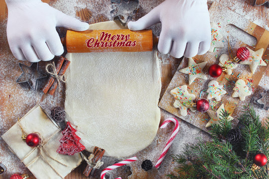 Flour cooking ginger cookies on Christmas Eve