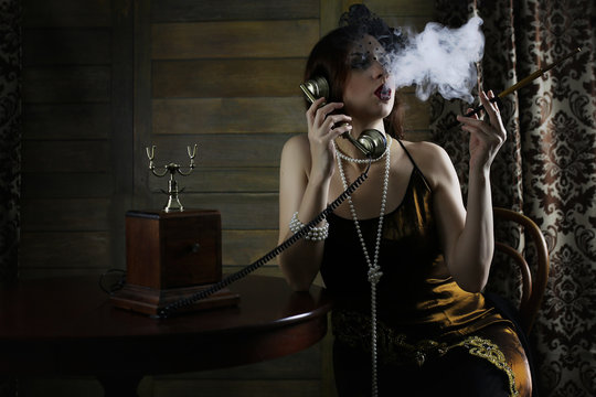 Beautiful 1930s girl smokes