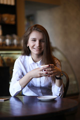 The girl in the cafe breakfast