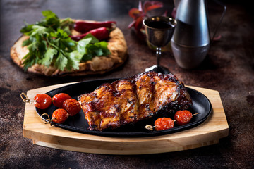 Grilled pork BBQ ribs and glass red wine