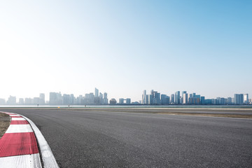 empty asphalt road with cityscape of modern city