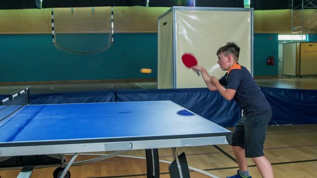A really fast game of table tennis. Children enjoy PE in the school gym a lot because they can do different activities.