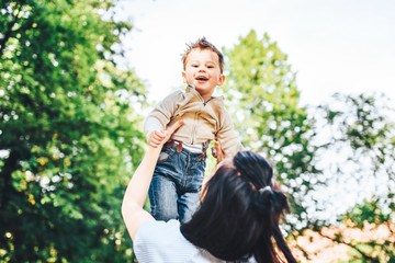 Obraz premium Mother with her little son outdoor in the park