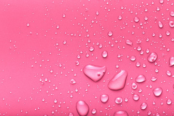 Drops of water on a color background. Pink. Toned