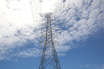 High voltage tower and blue sky. Energy concept.