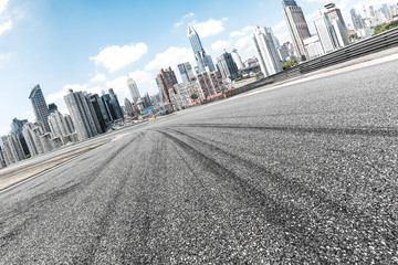 empty asphalt road with cityscape of modern city