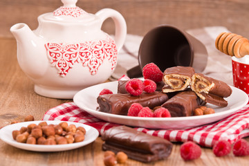 Chocolate rolls with hazelnuts and raspberries.
