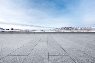 empty marble floor with beautiful snow mountains