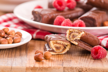Chocolate rolls with hazelnuts and raspberries.