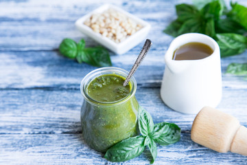 pesto sauce with raw ingredients. Basil pesto sauce