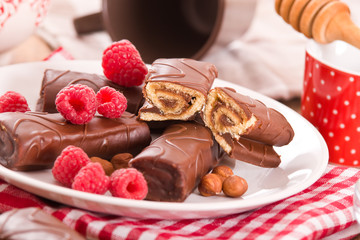 Chocolate rolls with hazelnuts and raspberries.