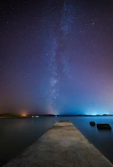 Abwaschbare Fototapete Night scene with stone pier and starry sky © Antonio