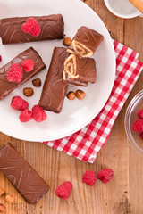 Chocolate rolls with hazelnuts and raspberries.