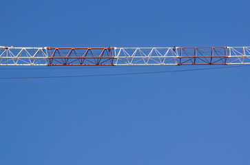 part of arm machinery construction crane with blue sky background