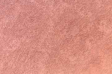 Red stucco surface.