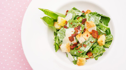 close up of caesar salad on a table.