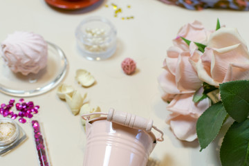 Flowers, marshmallows, cream color, rose. Still life.