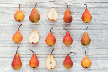 Abstract composition of fresh ripe fruits on a white wooden background.