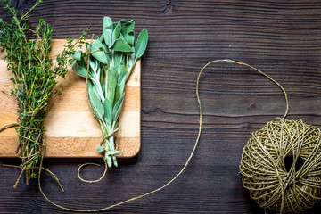 harvesting herbs for winter top view on wooden background