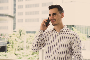 Businessman calling by mobile phone